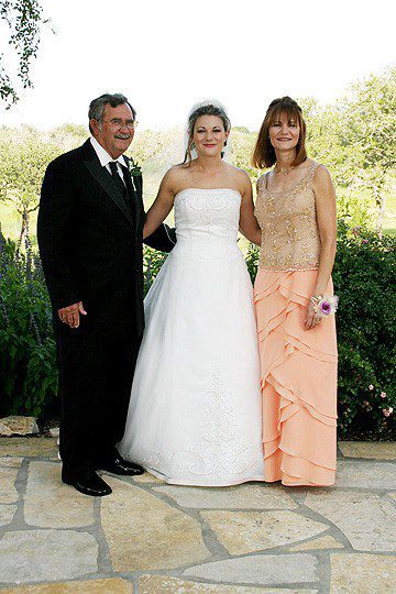 Bride formal with parents formal photograph before wedding