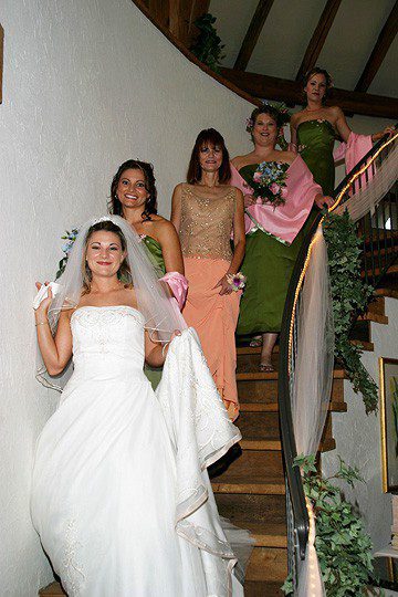 Bride leading the way down the stairway