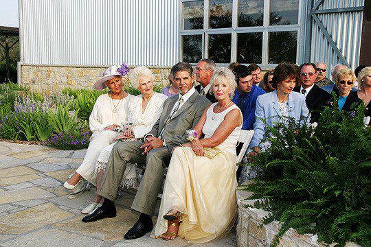 Wedding guests waiiting parents of groom