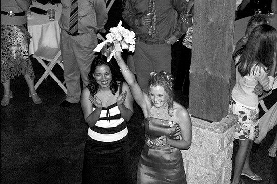 Catching Bouquet at the wedding reception in fredericksburg