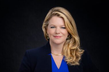 blonde woman executive headshots dark backdrop san antonio