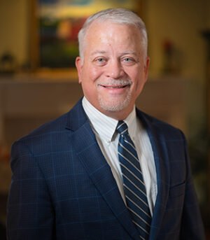 man smiling wearing suit