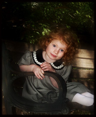 Young girl with curly red hair
