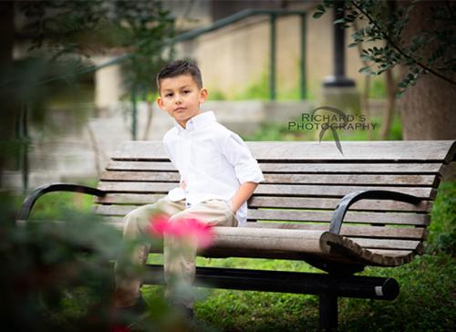portrait of boy at family photo session pearl brewery river walk area