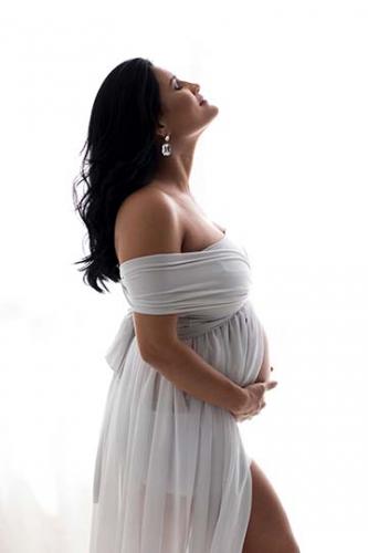 pregnancy-photography-woman-wearing-white-dress-san-antonio-studio